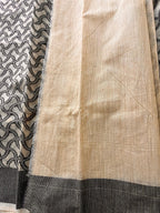 Beige and black handloom saree with geometric woven pattern and striped border